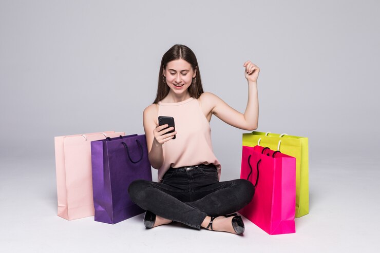 Woman happily shopping online with Coupon Dunia